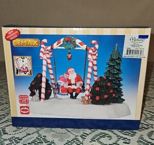 Lemax Festive Swing with Santa and Mrs. Claus